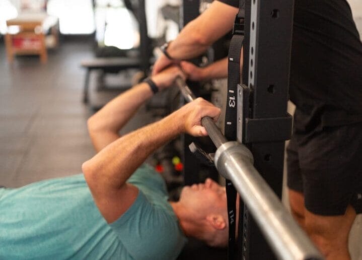 Man working out with a trainer